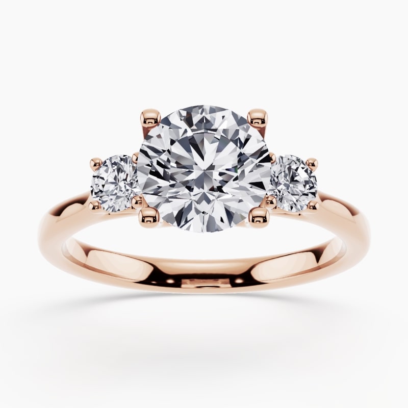 Image 40: Side-stone engagement ring with accent diamonds on a white gold band