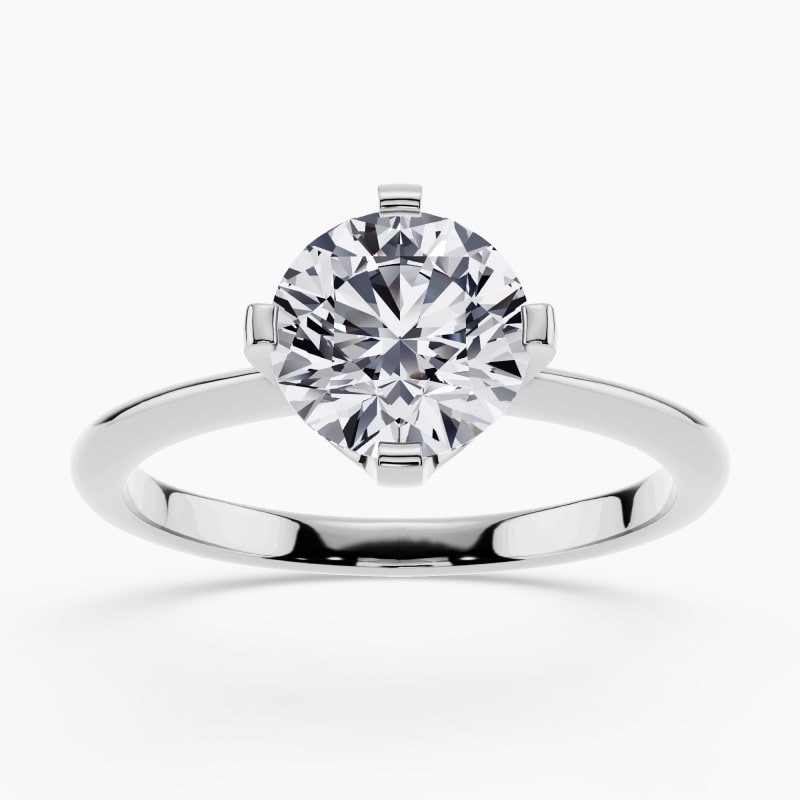 Image 37: Solitaire diamond ring in a classic four-prong setting